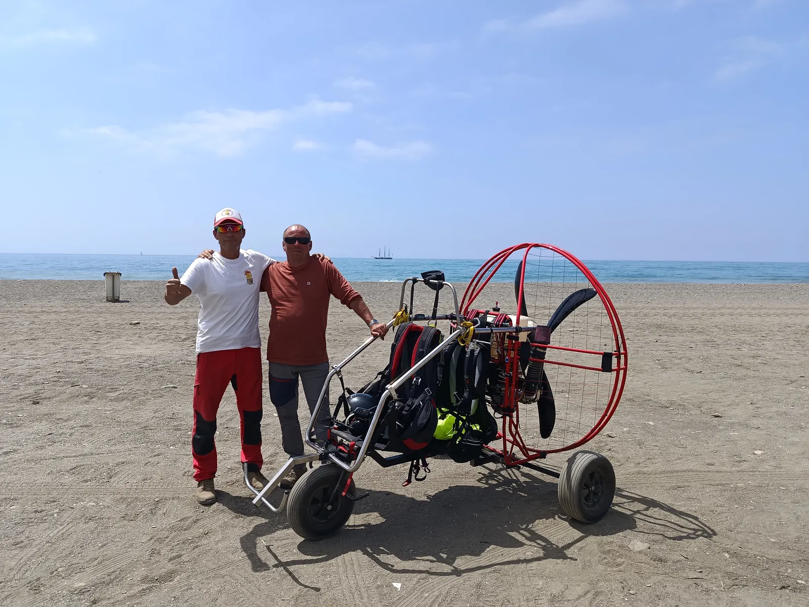 Paramotor instructor and student together on Benajarafe beach before a private flying lesson