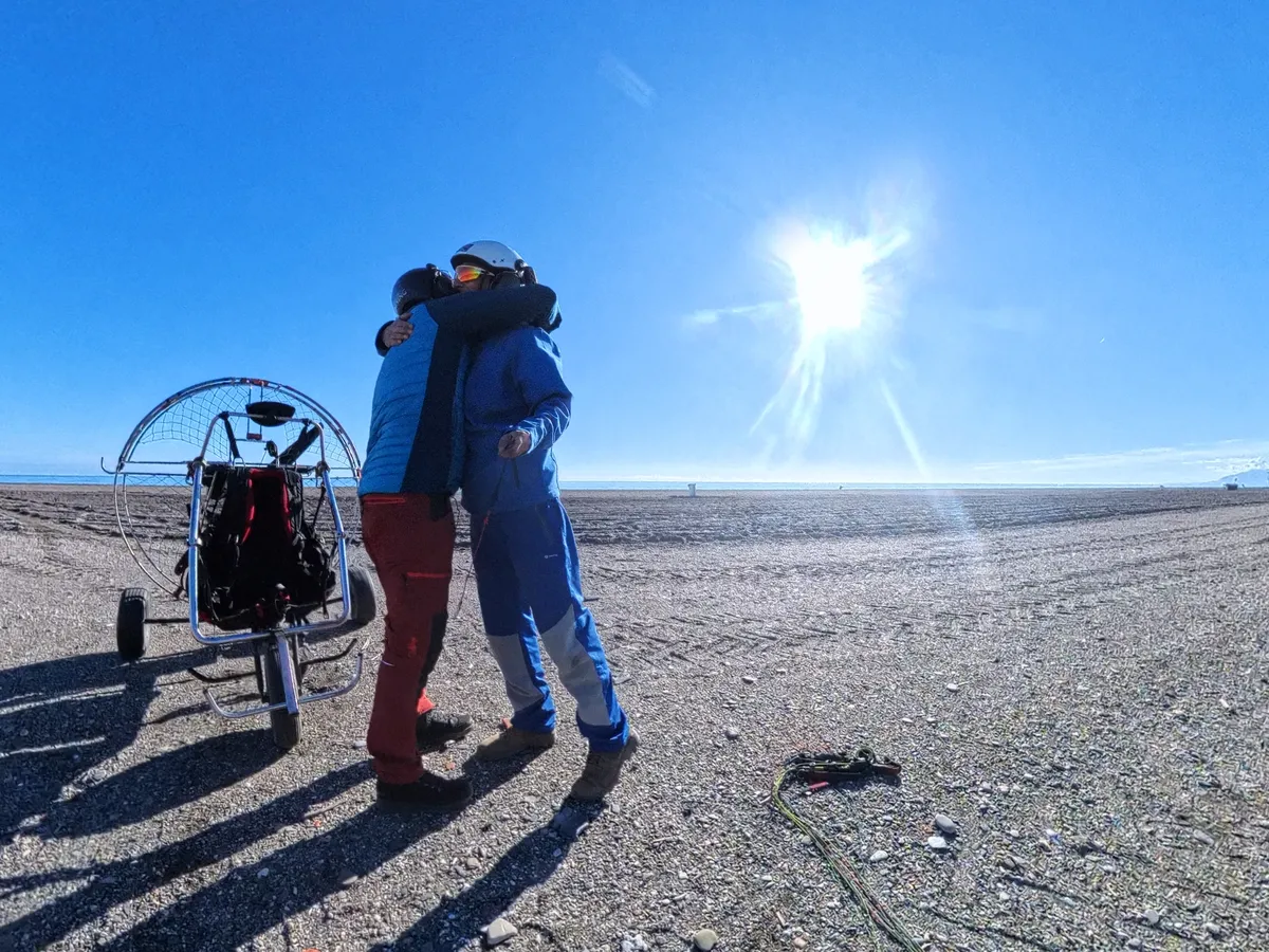Paramotor instructor and student together, one-to-one training session