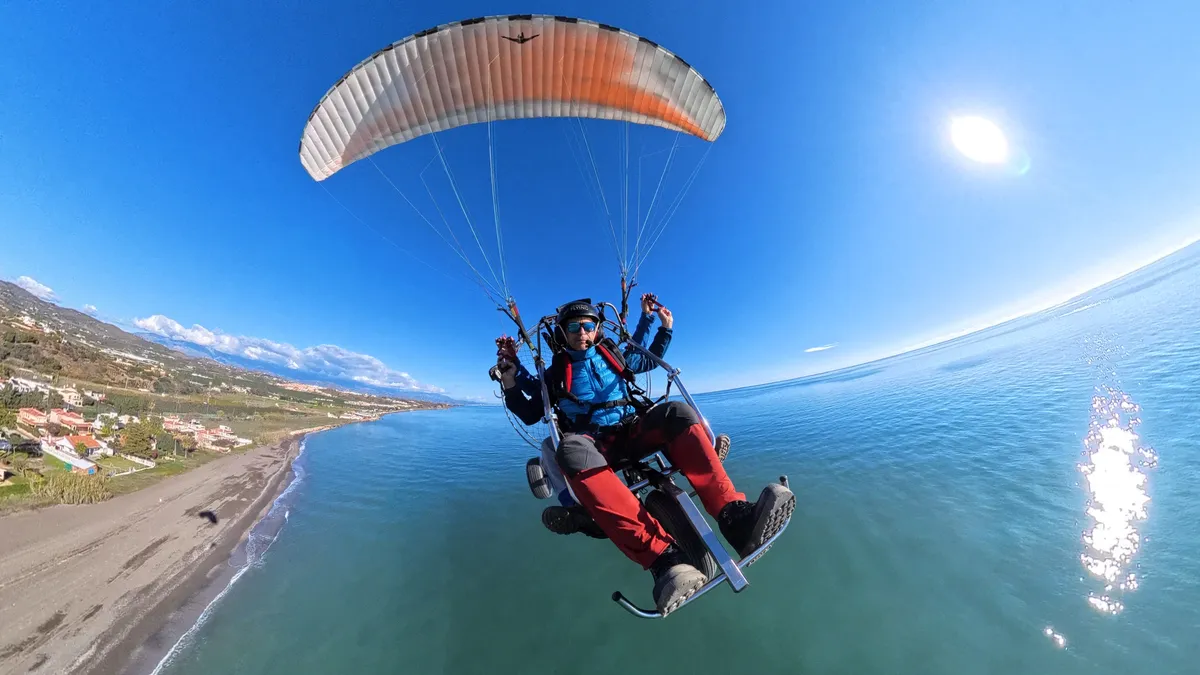 Instructor and student flying together, one-to-one paramotor lesson over the Costa del Sol